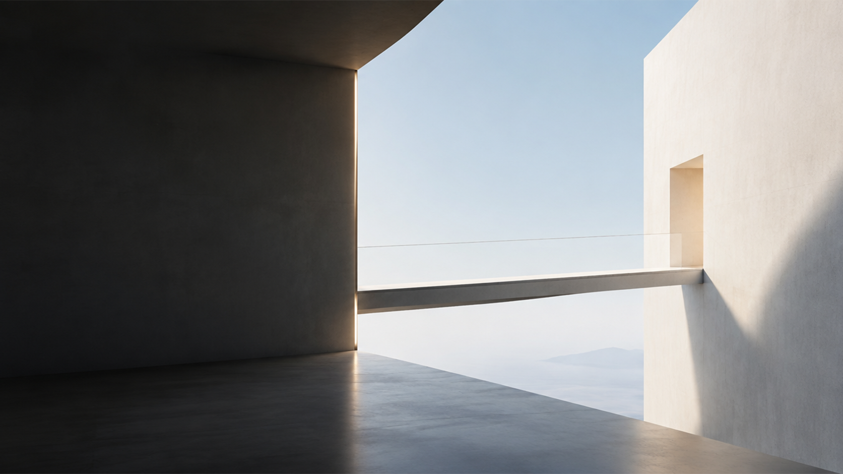 Passadiço estreito liga dois edifícios minimalistas sobre uma paisagem costeira